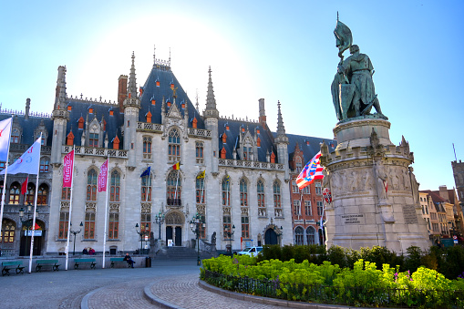 Bruges, Belgium - April 26, 2019 - The Provinciaal Hof (Province Court) is a Neogothical building on the market place in Bruges, Belgium.