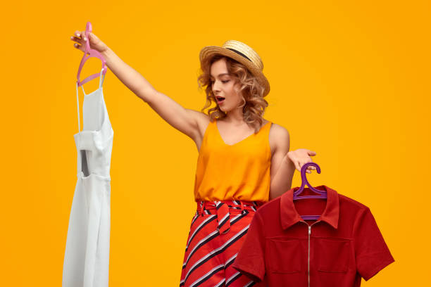 istock Trendy woman choosing between clothing 1167454924