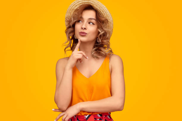 istock Dreamy female touching chin smiling away 1167455063