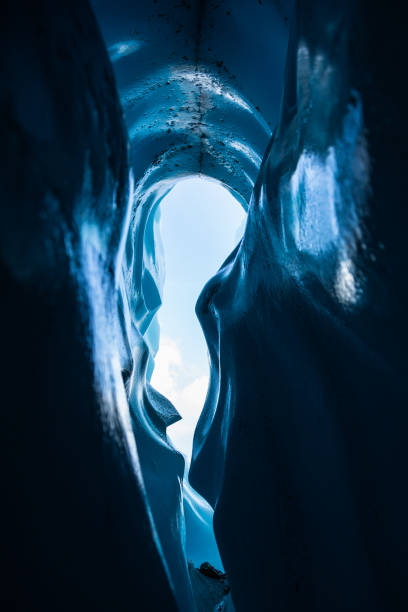 istock Looking out at the sky from deep inside a crevasse ice cave on the Matanuska Glacier in Alaska. 1167458918
