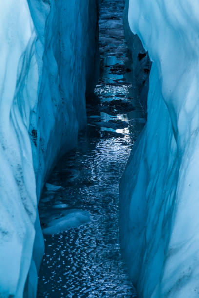 istock Water filled crevasse reflecting the sky from deep within the Matanuska Glacier. 1167459241