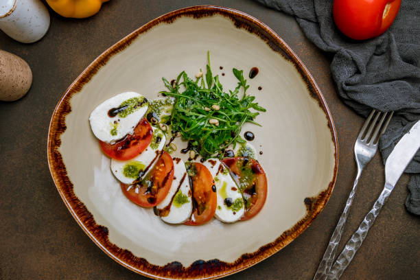 istock Caprese salad with mozzarella and tomato 1167460458