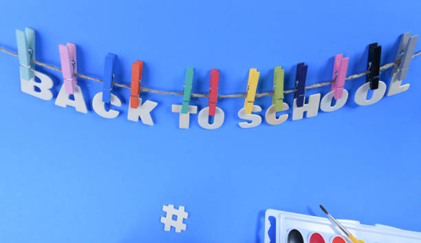 istock Back to school supplies on a blue background 1167466079