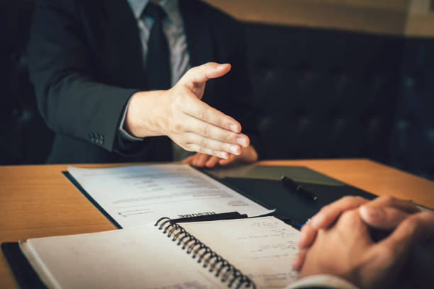 istock Confident partnerships people shaking hands with making a contract in the office. 1167467602