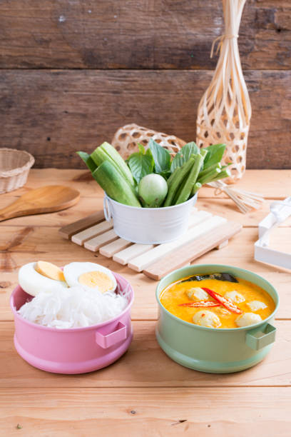 istock Coconut milk Curry fish and fish ball with thai rice noodle 1167468910