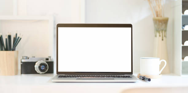 istock Professional photographer's workplace with open blank screen laptop 1167475343