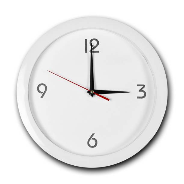 istock Large round white wall clock with white frame. The hands point to 3 o'clock. Close up. Isolated on white background 1167478318
