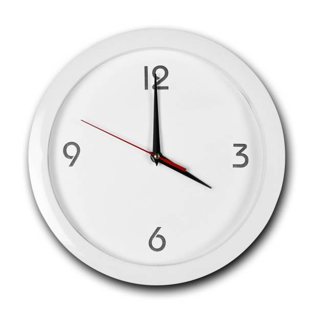 istock Large round white wall clock with white frame. The hands point to 4 o'clock. Close up. Isolated on white background 1167478332