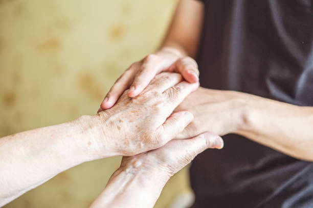 istock young and old, next and previous  generation hands touch each other, people connection concept 1167480431