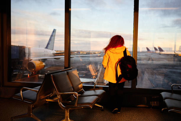 istock Waiting for the plane, looking out on the window 1167484379