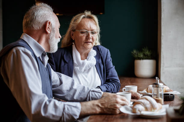 istock Happy senior couple enjoying coffee break 1167486368