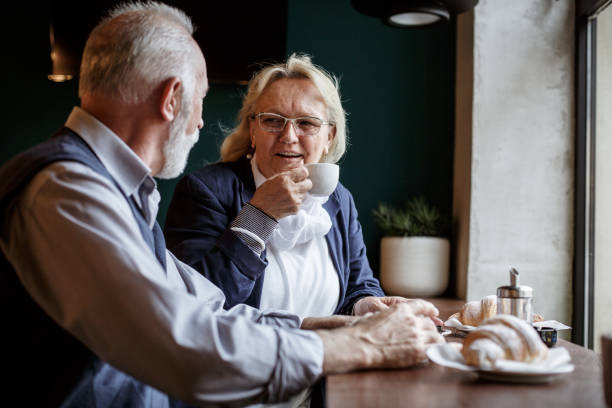 istock Senior couple enjoying coffee break 1167486382