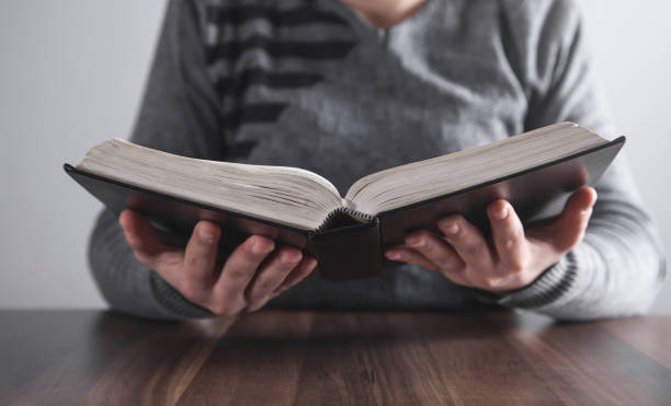 istock Girl reading book in office. 1167488072