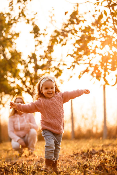 istock Smiling two year old girl enjoying while playing at the park 1167490029