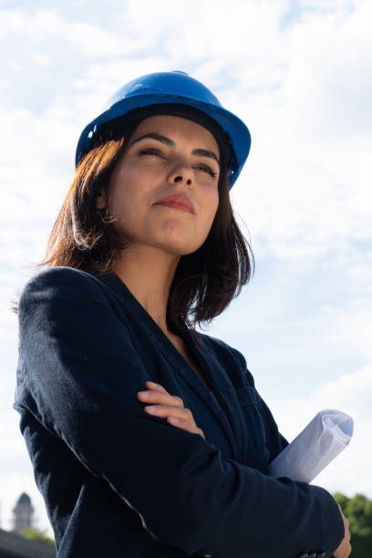 istock Charming woman architect posing with folded arms 1167496804