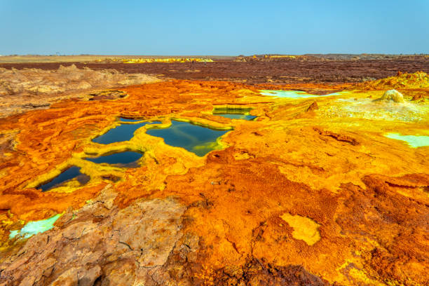 Dallol, Ethiopia. Danakil Depression Beautiful small sulfur lakes Dallol, Ethiopia. Danakil Depression is the hottest place on Earth in terms of year-round average temperatures. It is also one of the lowest places on the planet danakil desert photos stock pictures, royalty-free photos & images