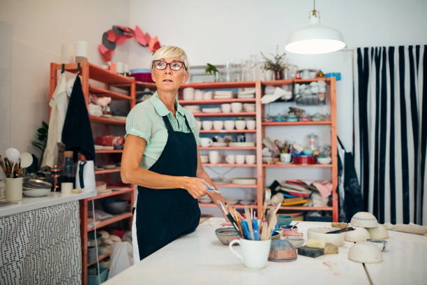 istock Senior Woman Looking Away At Ceramics Workshop 1167497409