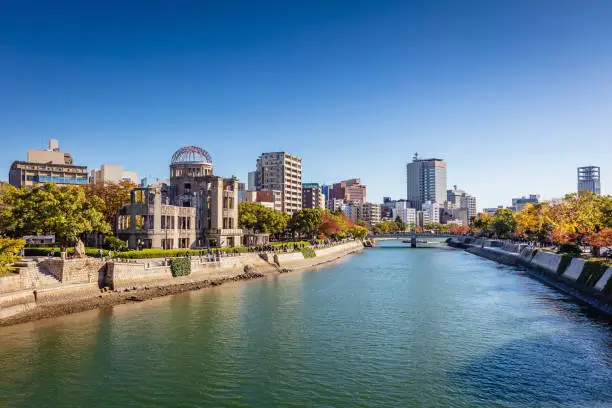 Hiroshima Cityscape on a Sunny Autumn Day. View over the Motoyasu River, Atomic Bomb Dome on the left side of the Motoyasu River. Naka Ward, Hiroshima, Japan, Asia.