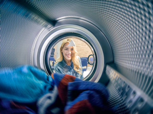 istock Young woman having a laundry day 1167498729