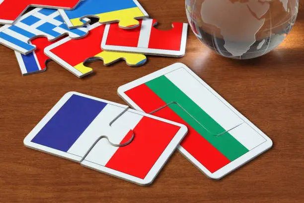 puzzle with the national flag of French and Bulgaria on wooden table