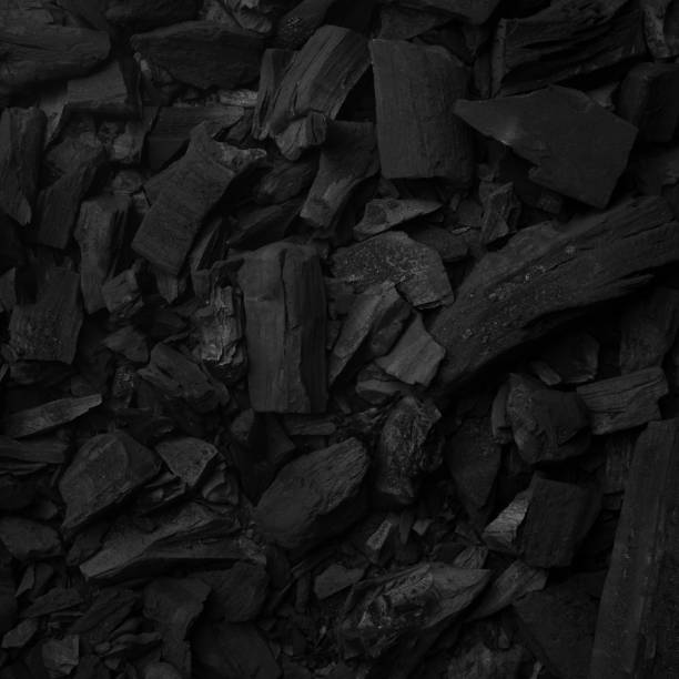 istock Black charcoal background for preparing grill food 1167502900