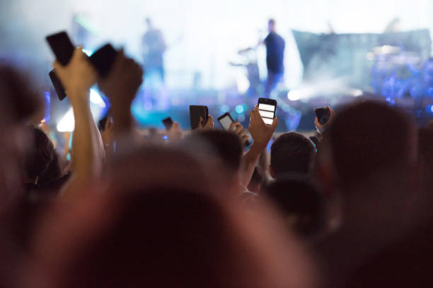 istock People taking photos with smart phones during a mconcert 1167503220