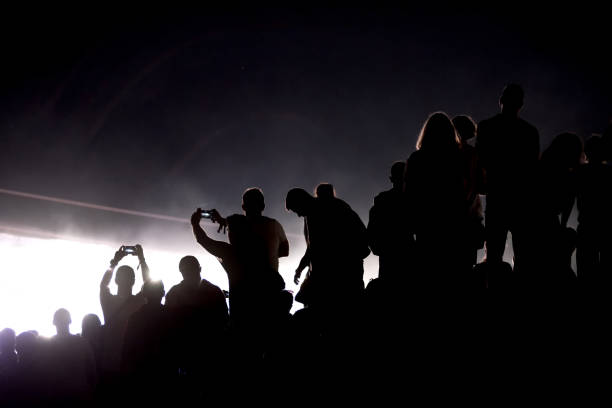 istock Silhouette of concert crowd and stage lights 1167503253