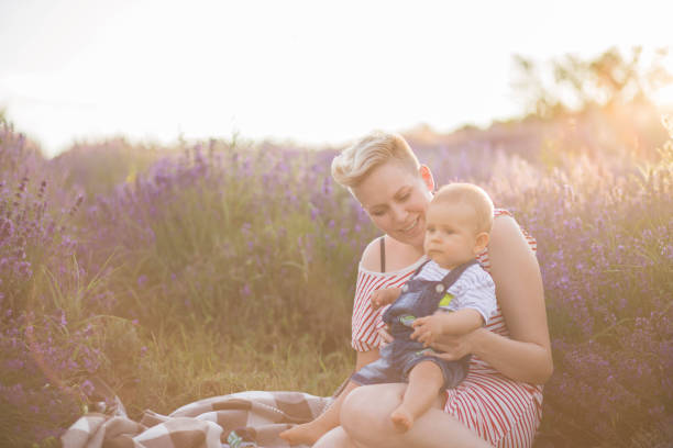 istock Happy mother with little son playing on lavender field 1167504102