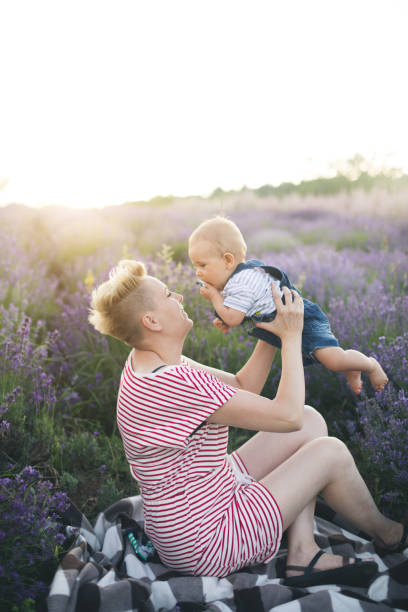istock Happy mother with little son playing on lavender field 1167504312