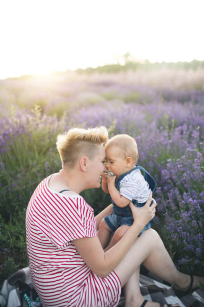 istock Happy mother with little son playing on lavender field 1167504769