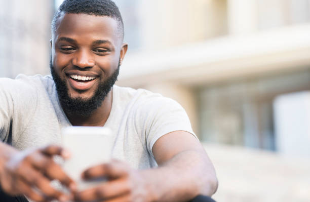 istock Happy african guy having video call with parents 1167505664