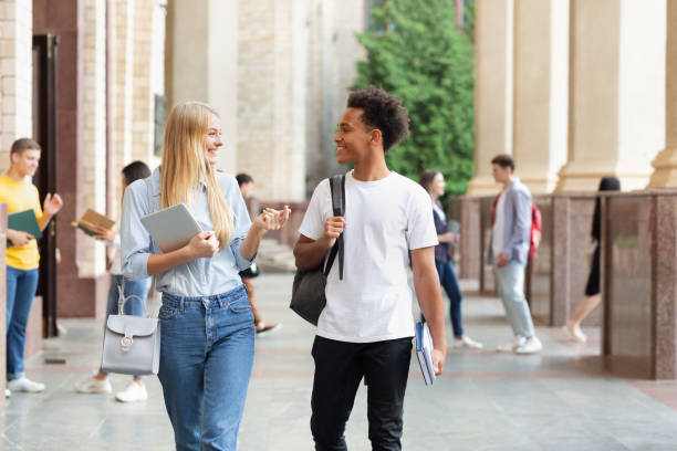 istock Multiracial students walking in university campus during break 1167505747