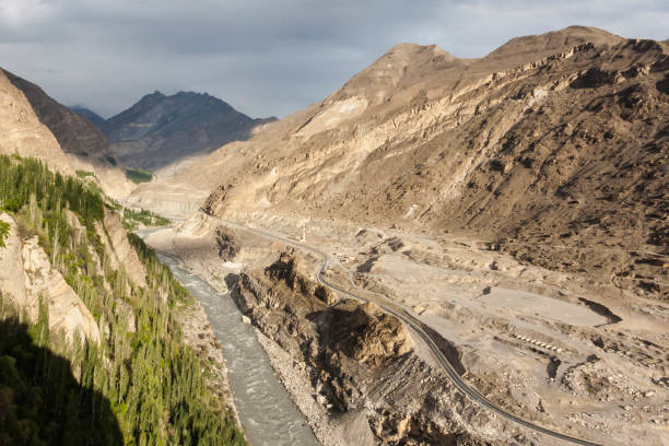 Hunza River and Karakoram Highway View of historical Hunza River and Karakoram Highway from Altit Fort. karakoram highway stock pictures, royalty-free photos & images