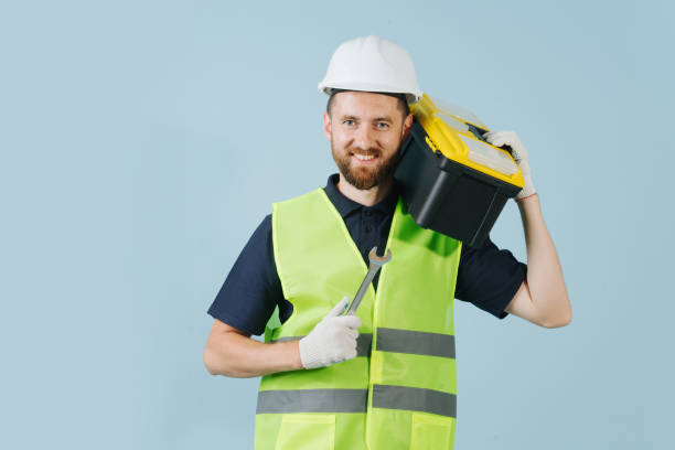 istock Construction worker with tool case in a white helmet and yellow safety vest 1167506509