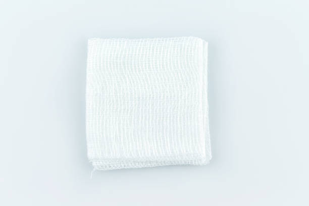 gauze pads on white background. - padding imagens e fotografias de stock