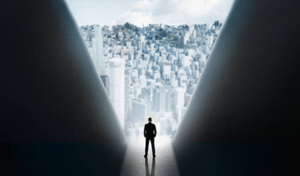 istock Man standing on break to the modern city between big walls 1167515413