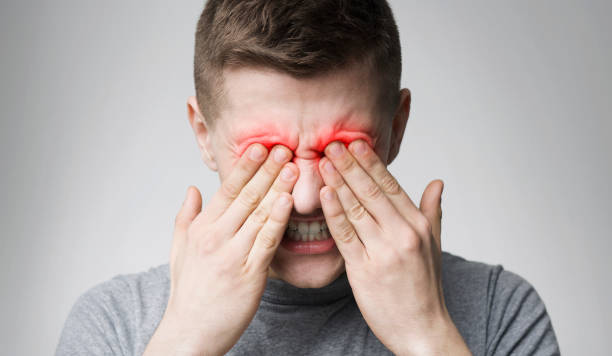 istock Tired man suffering from eye pain, rubbing red sore zone 1167515430
