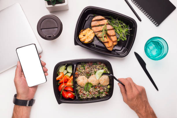 istock Man eating healthy food preparing on grill on workplace 1167515827
