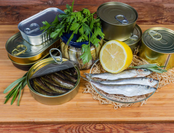 istock Sprats in open tin can among canned fish, raw fish 1167517410