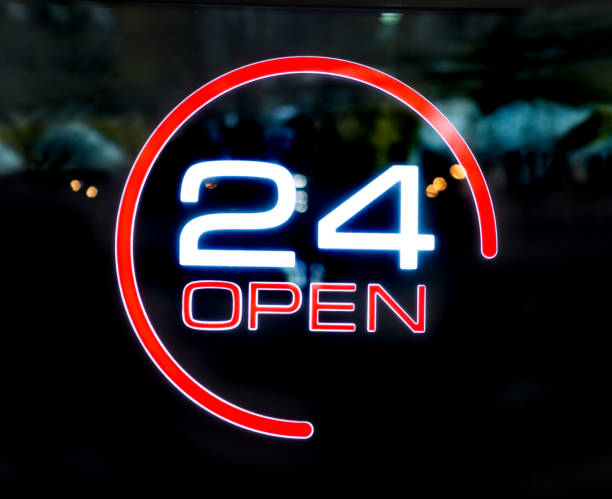 istock 24 hours openly written on the glass door 1167520115