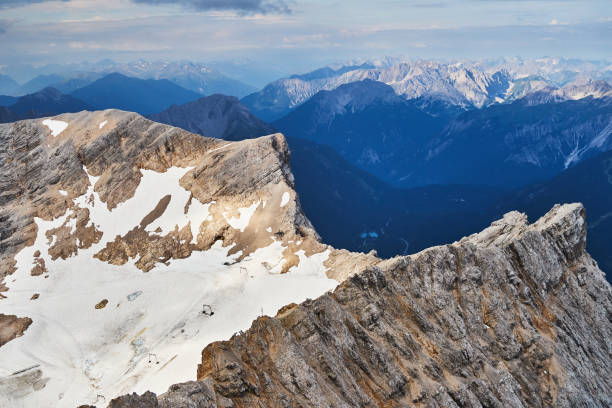 Dolomites mountains, Alpi Dolomiti beautiful scenic landscape in summer. Italian Alps mountain summits and rocky peaks above green valley alpine scene