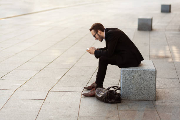 istock Modern young man playing on phone, browsing mobile news. Gadget Dependence 1167525710