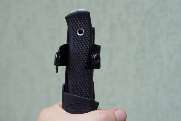istock black handle of a knife in a case holds a hand 1167527074