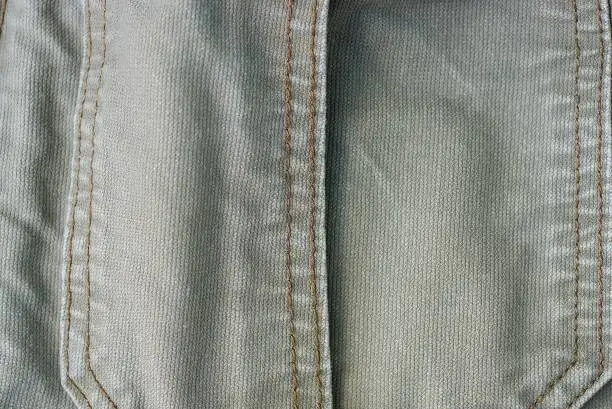 Photo of gray fabric background of a piece of cotton clothing
