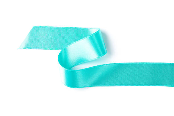istock Turquoise ribbon isolated on white background. Gift concept 1167528917
