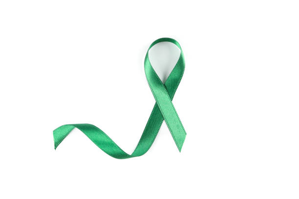 istock Green awareness ribbon isolated on white background 1167529076