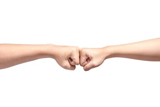 Hands of two men pumping their fists isolated over white background