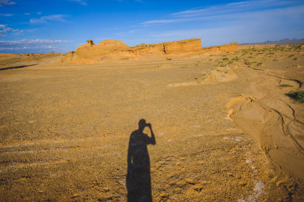 istock The shadow of photographer with Danxia landform 1167530794