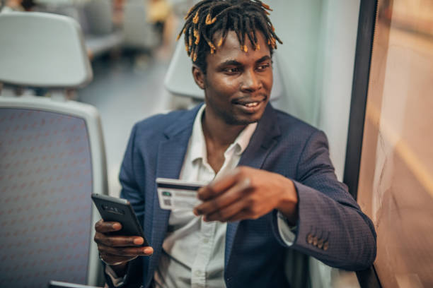 istock Black man with credit card in subway train 1167530874