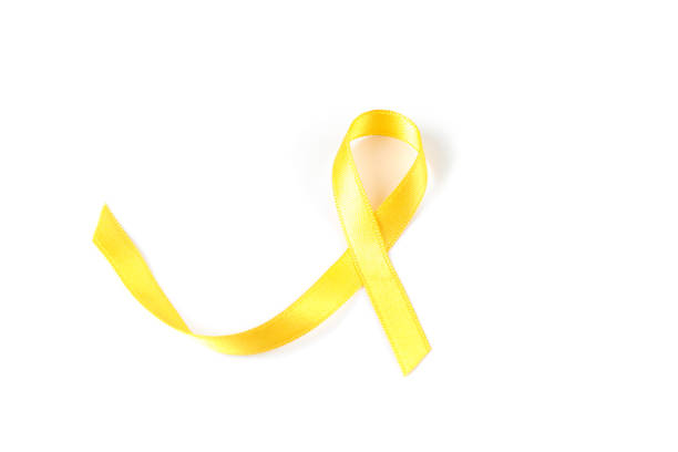 istock Yellow awareness ribbon isolated on white background 1167530906